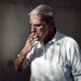 austin portrait photographer gritty portrait of a man smoking  thumbnail