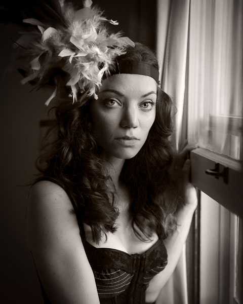 austin portrait photographer black and white photo of a girl with a feather