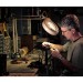 austin portrait photographer portrait of a man working at his bench in his garage tying flies for fishing thumbnail