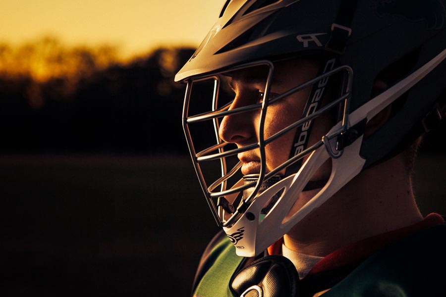 high school lacrosse senior portrait at dusk